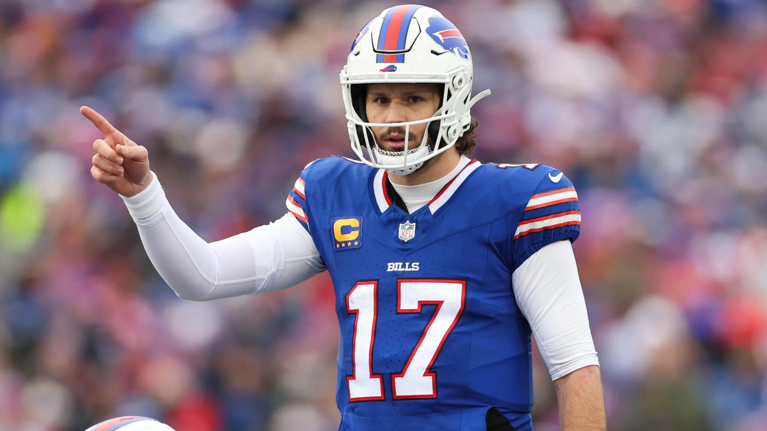 Buffalo Bills quarterback Josh Allen points to his team-mate during their Wildcard Weekend game agains the Denver Broncos