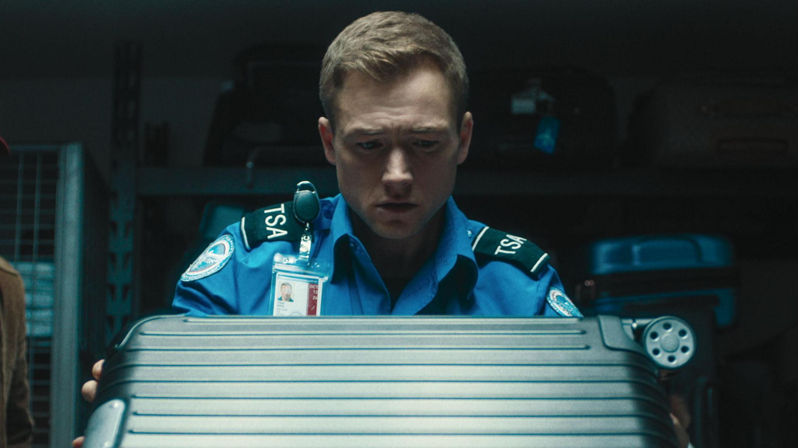 Taron Egerton as TSA agent Ethan Kopek in new film, Carry-On.