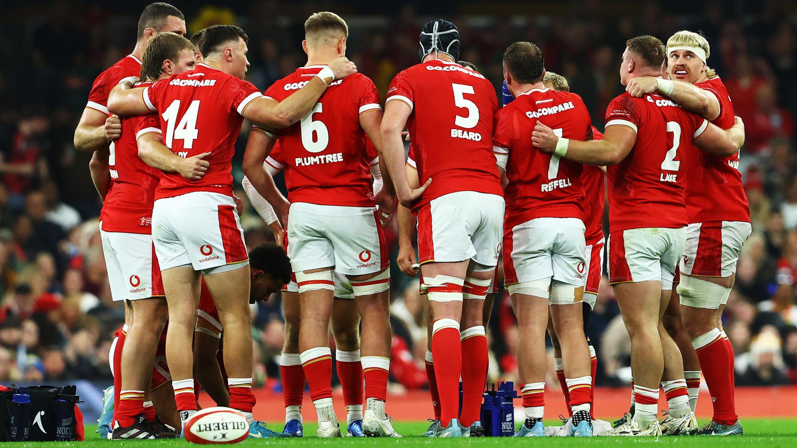 Wales players in a huddle