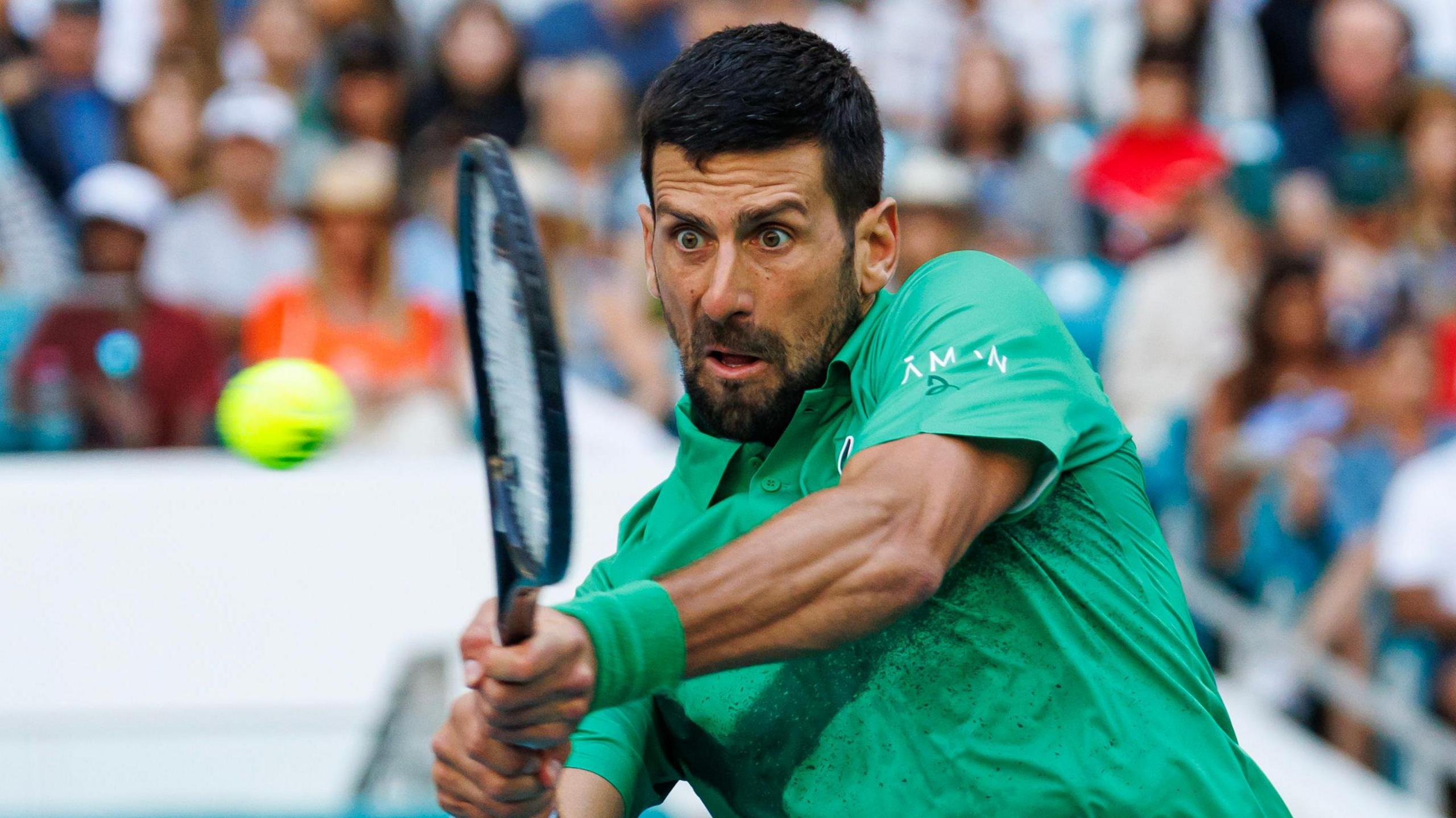 Novak Djokovic plays a backhand at the Miami Open