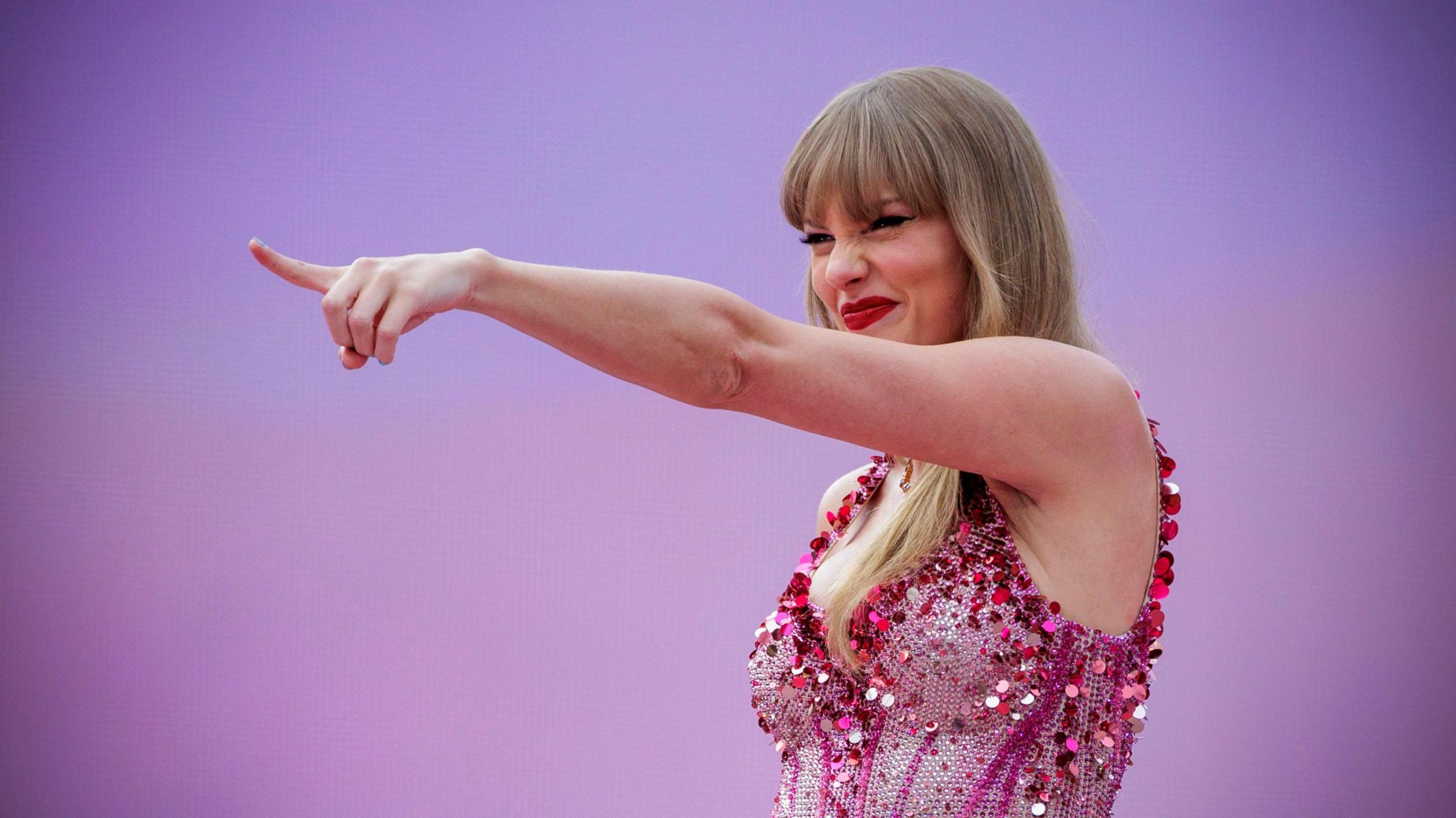 Taylor Swift wearing pink sequin top