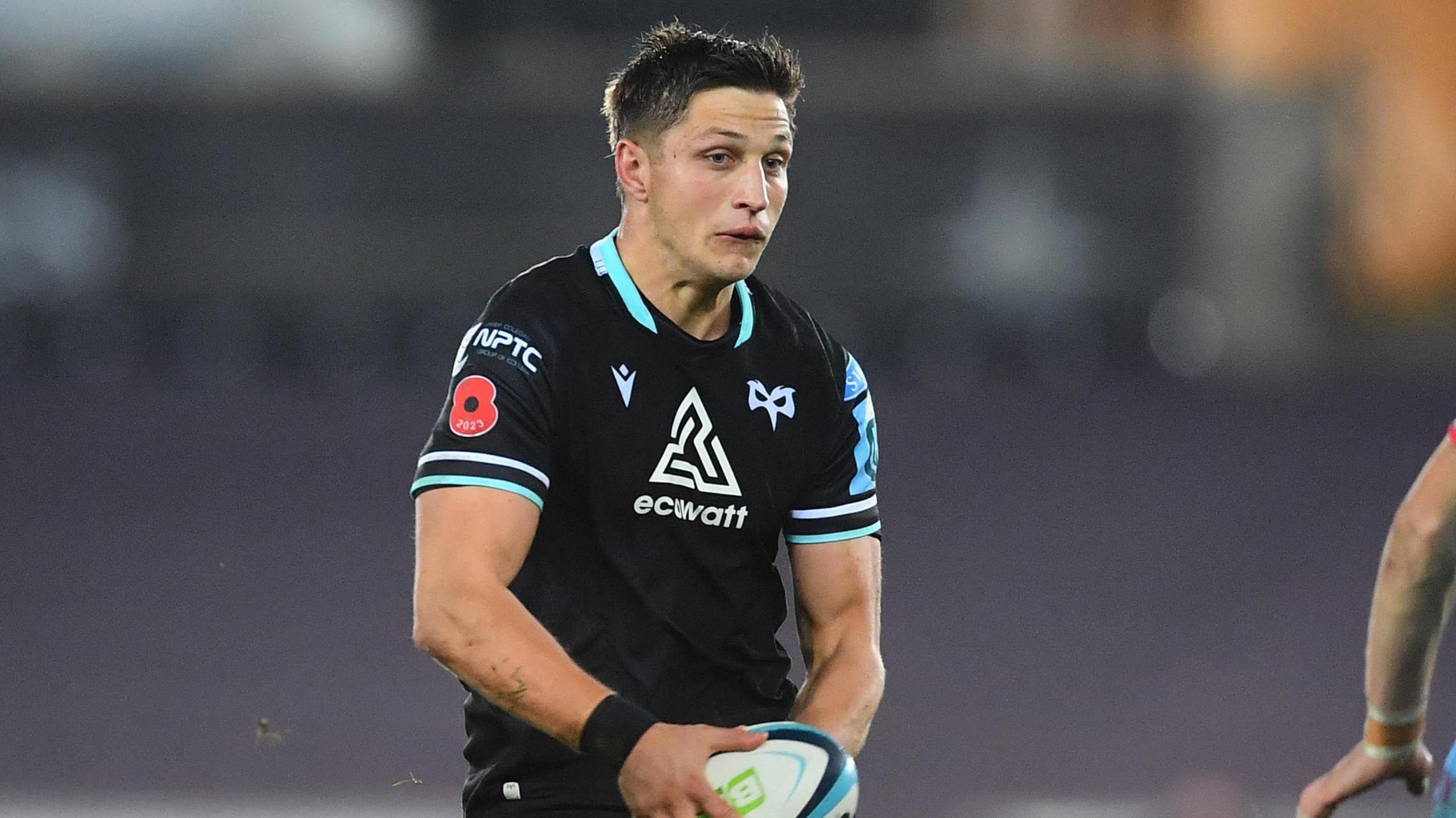 Max Nagy holding a rugby ball