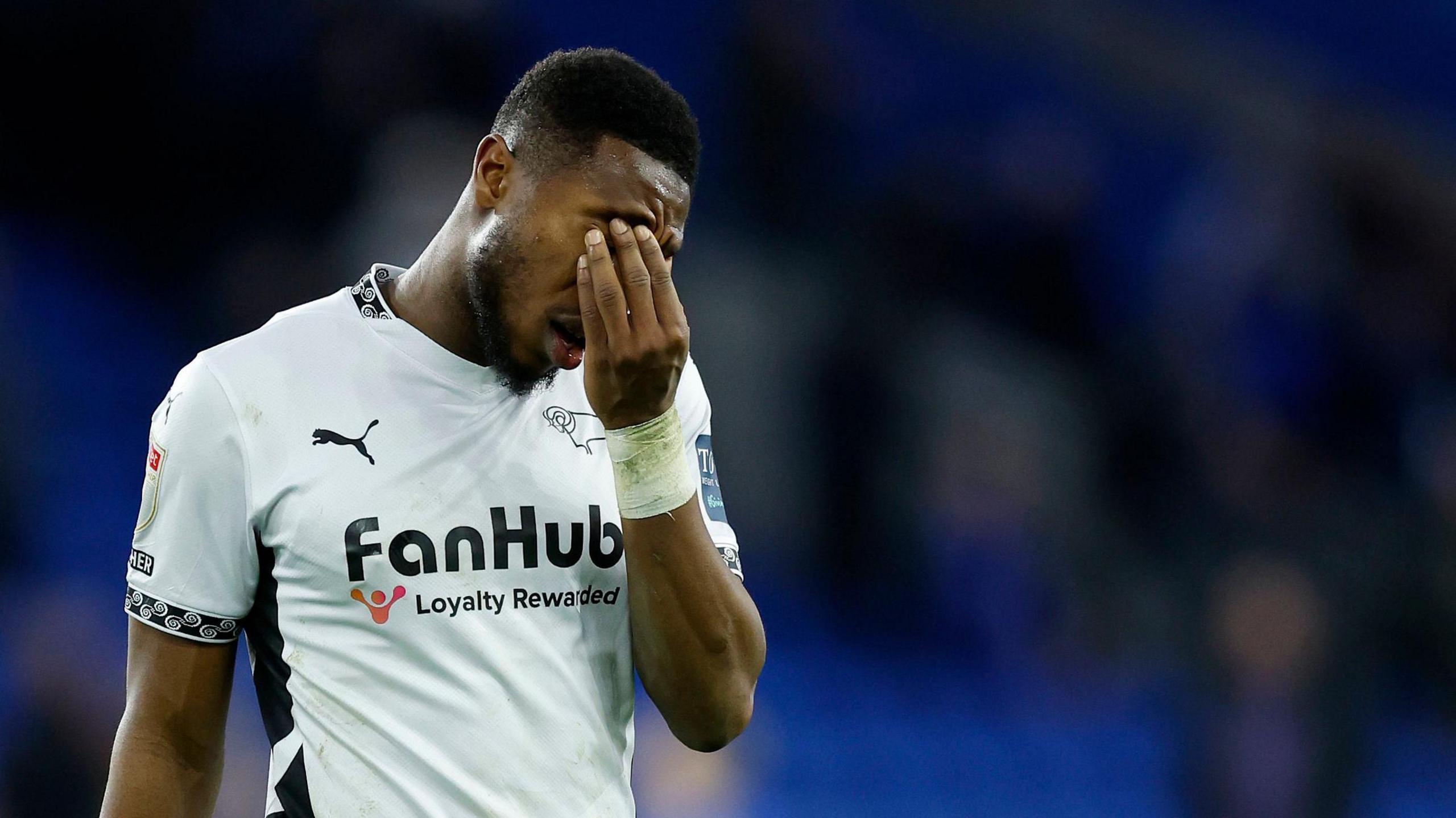 Derby County's Ebou Adams stands dejected after the Rams area beaten by Cardiff