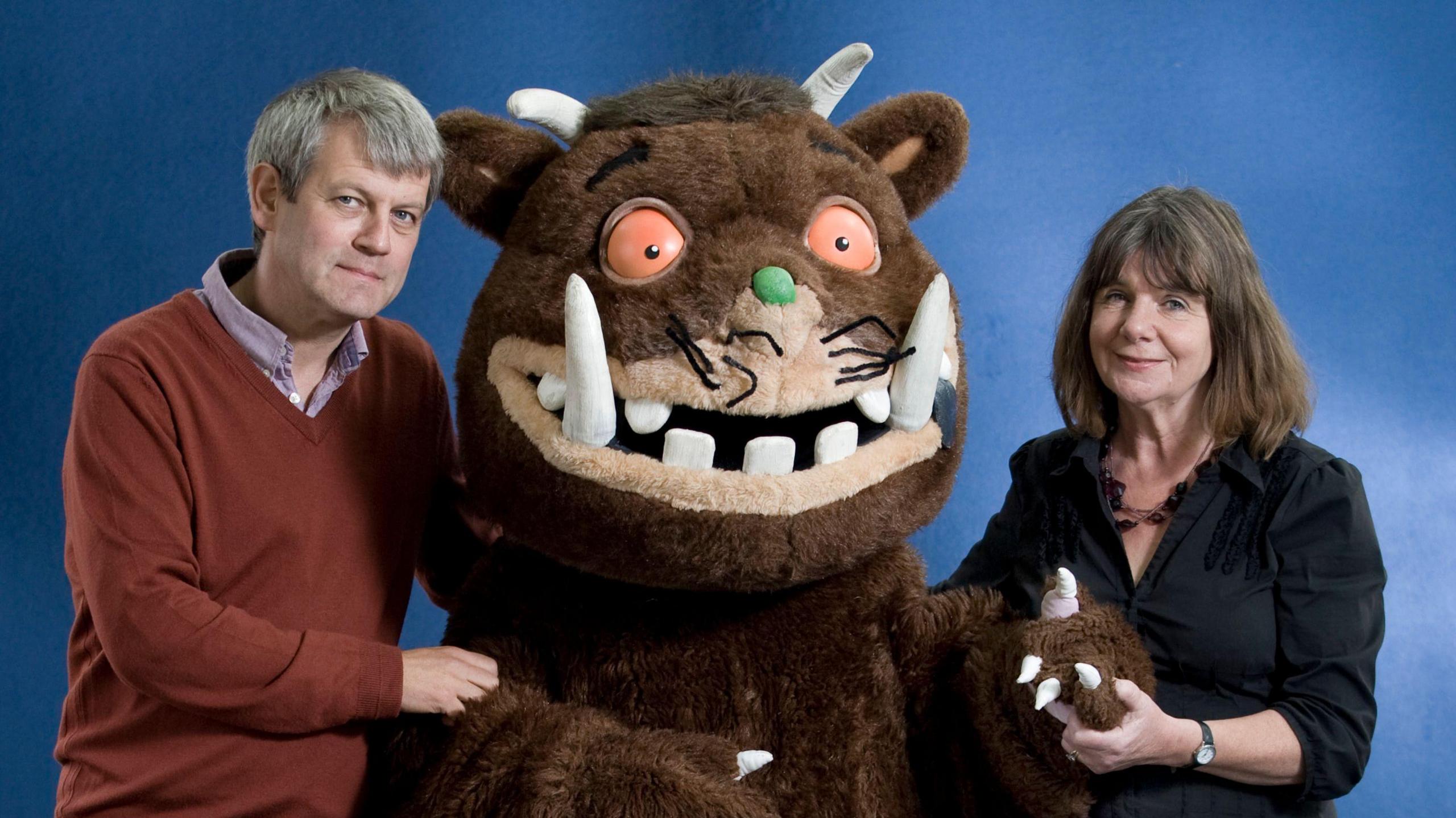 English writer and playwright Julia Donaldson and German illustrator Axel Scheffler pictured with a large Gruffalo toy.