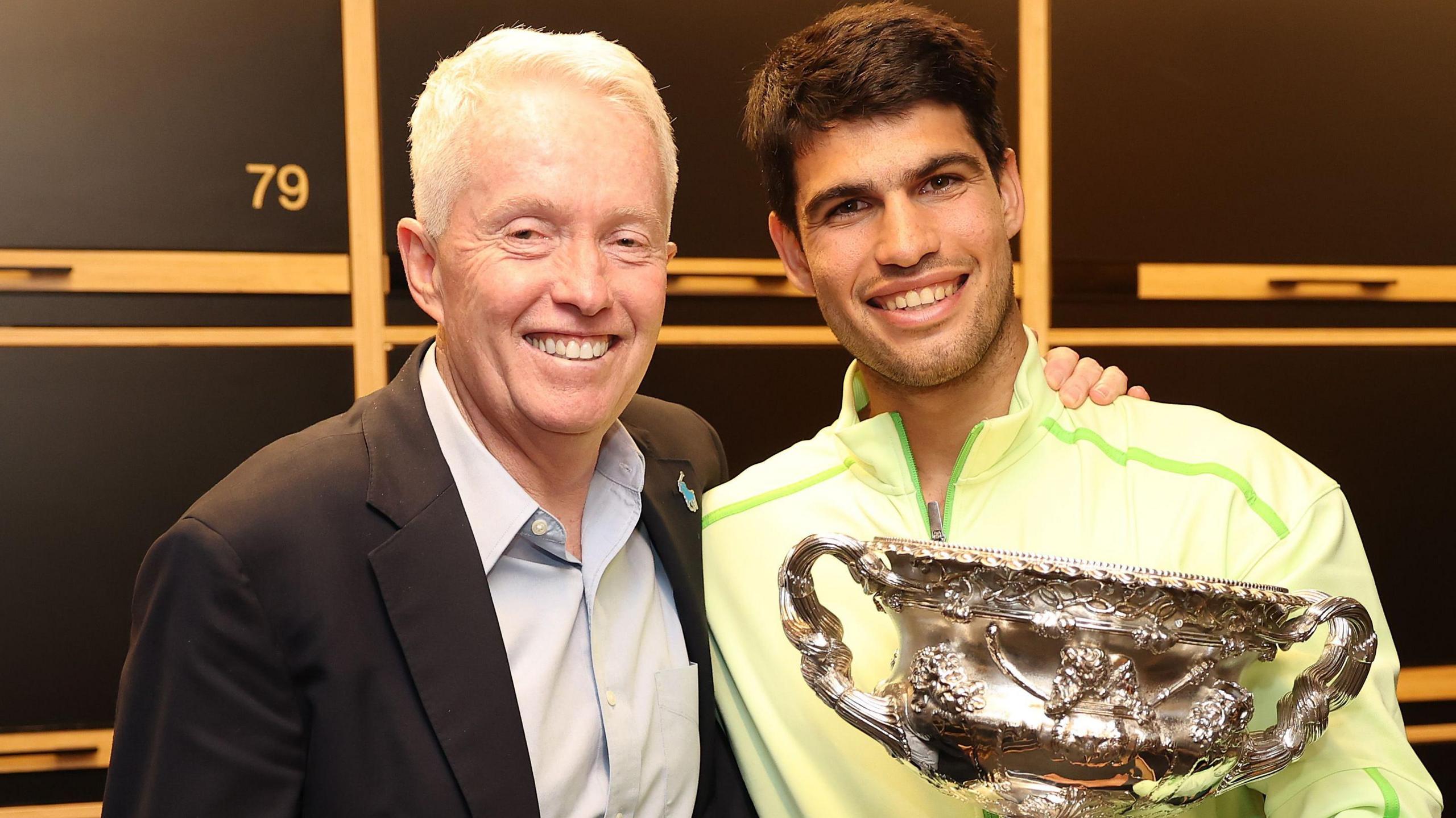 Craig Tiley poses for a photo with Australian Open men's singles champion Carlos Alcaraz