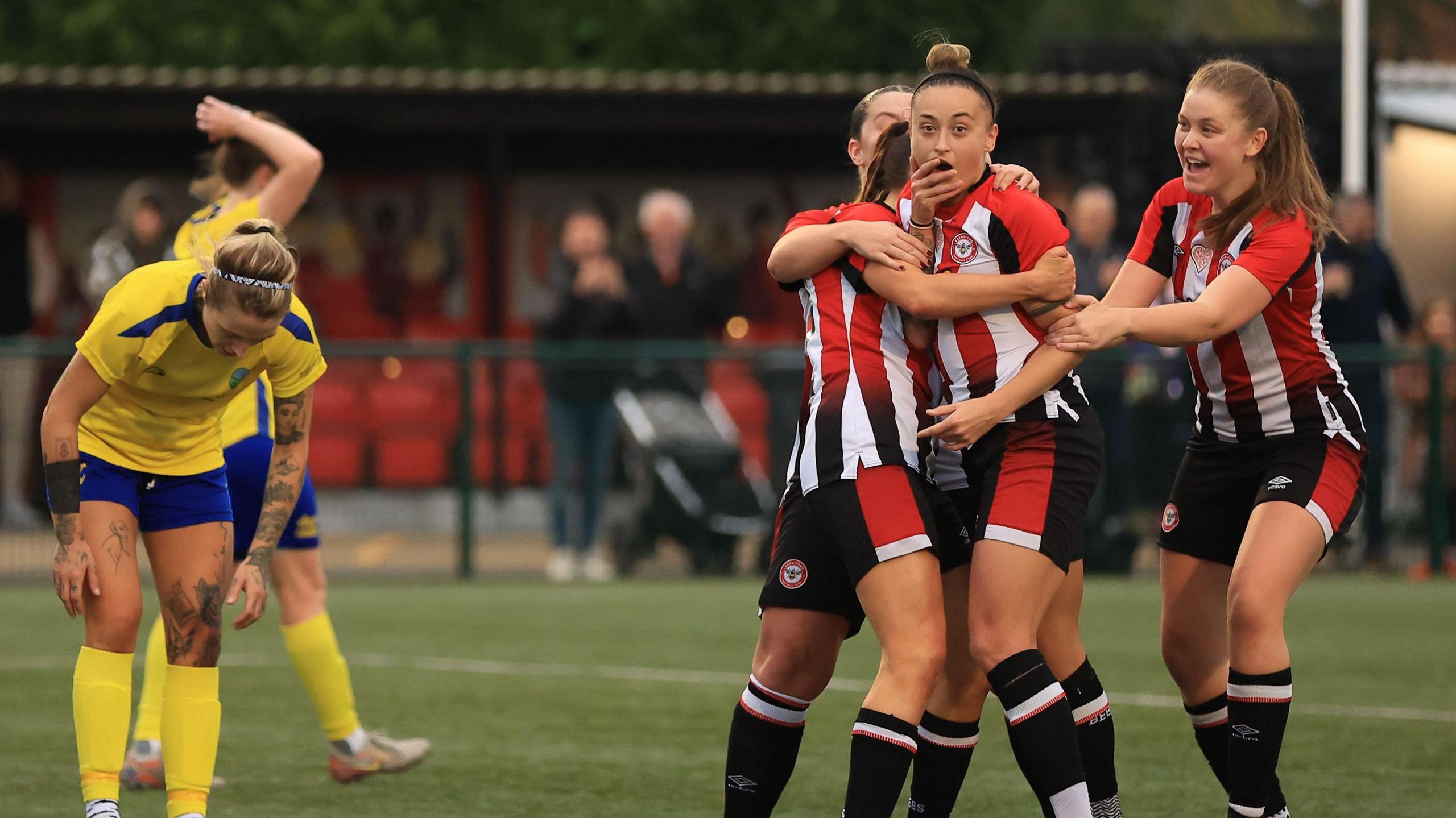 Ashley Cheatley celebrates with her Brentford team-mates