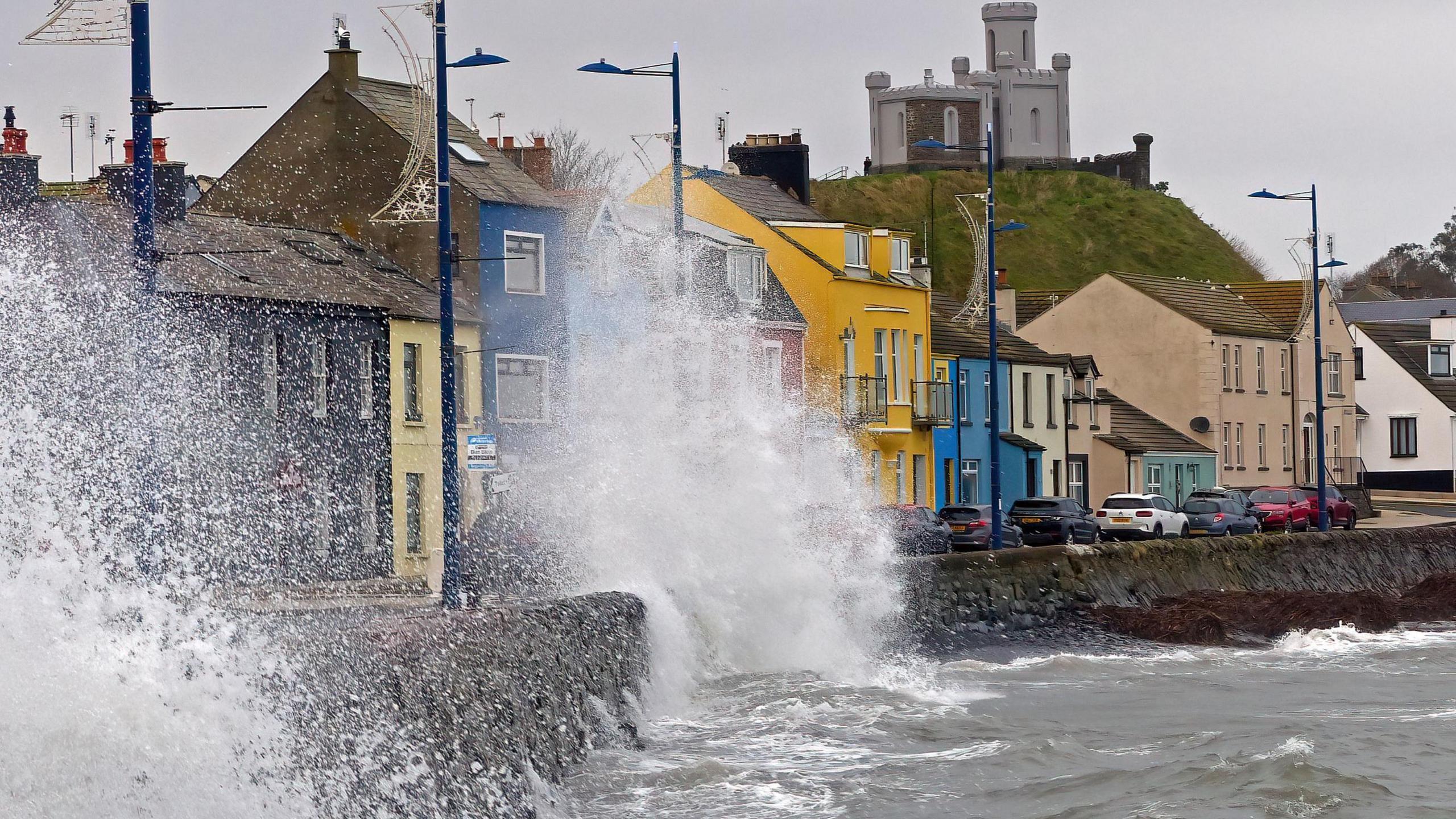 Waves crashing over the promenade at Donaghadee Co Down Northern Ireland