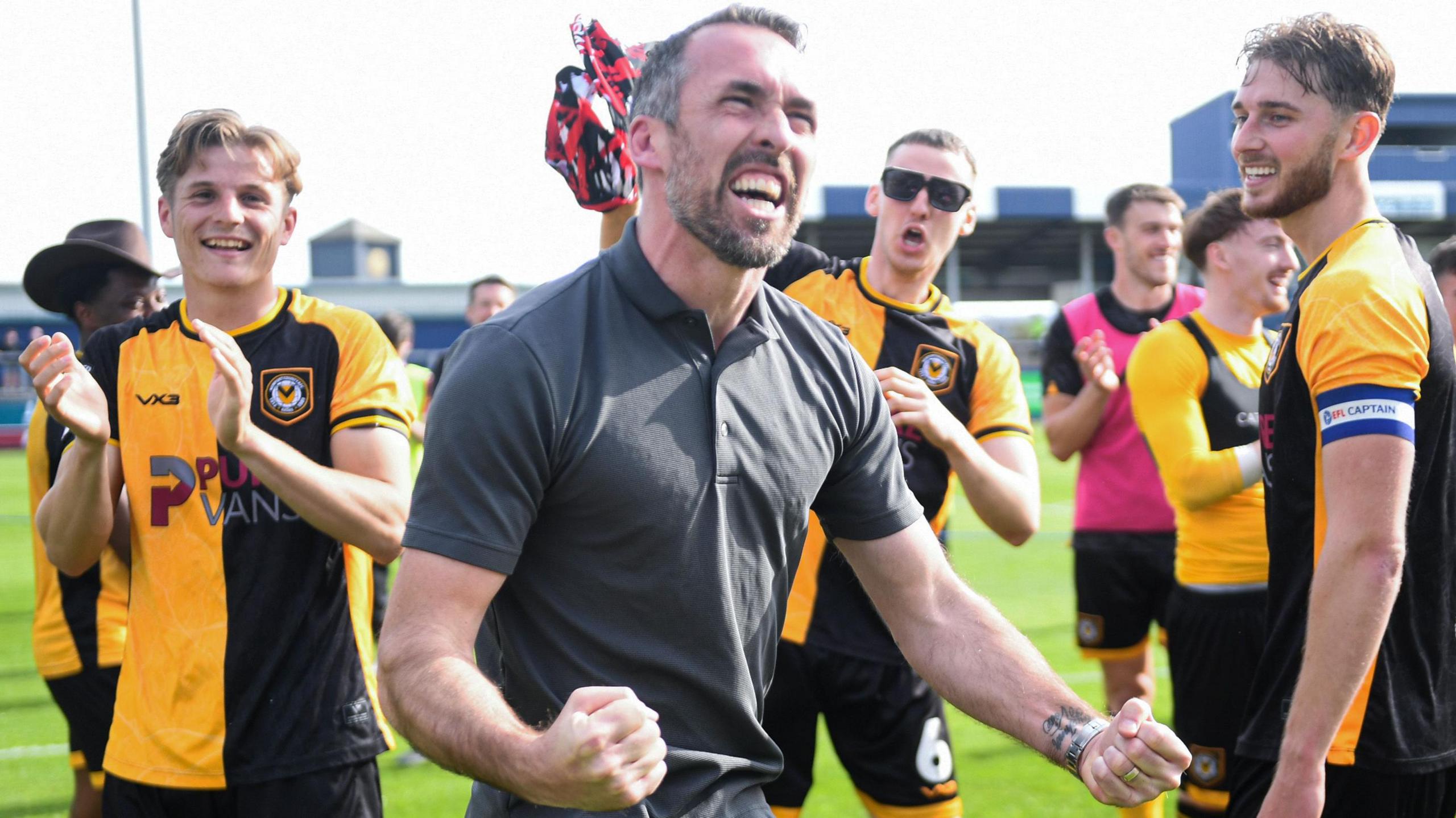 Christian Fuchs celebrating Newport County's final day survival in League Two.
