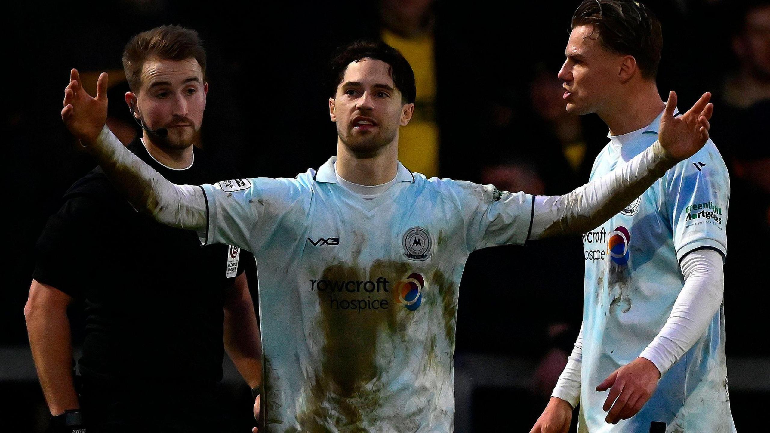Jordan Young (centre) shows his frustration after being sent off