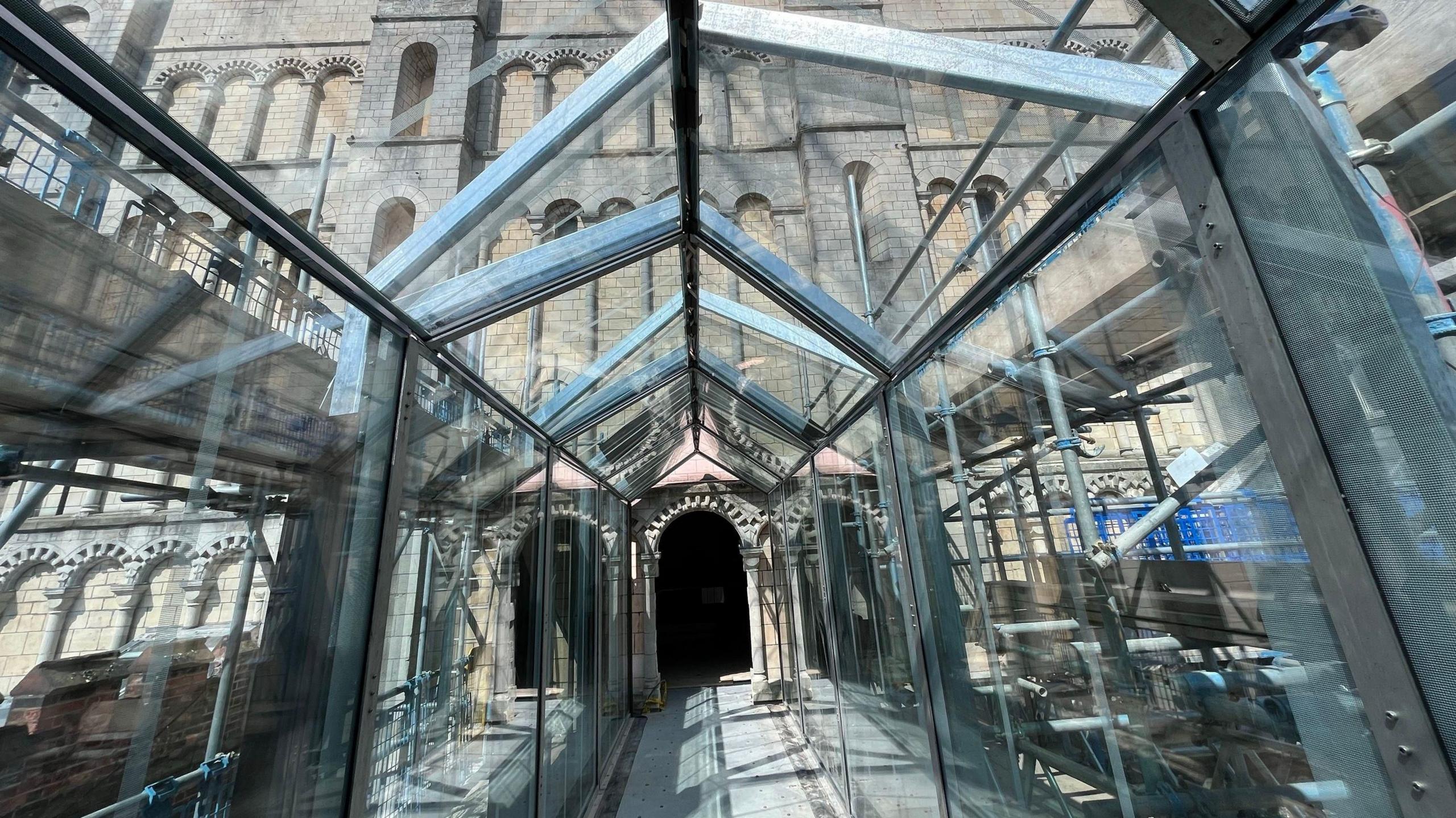 Looking down a glass atrium to the side of Norwich Castle