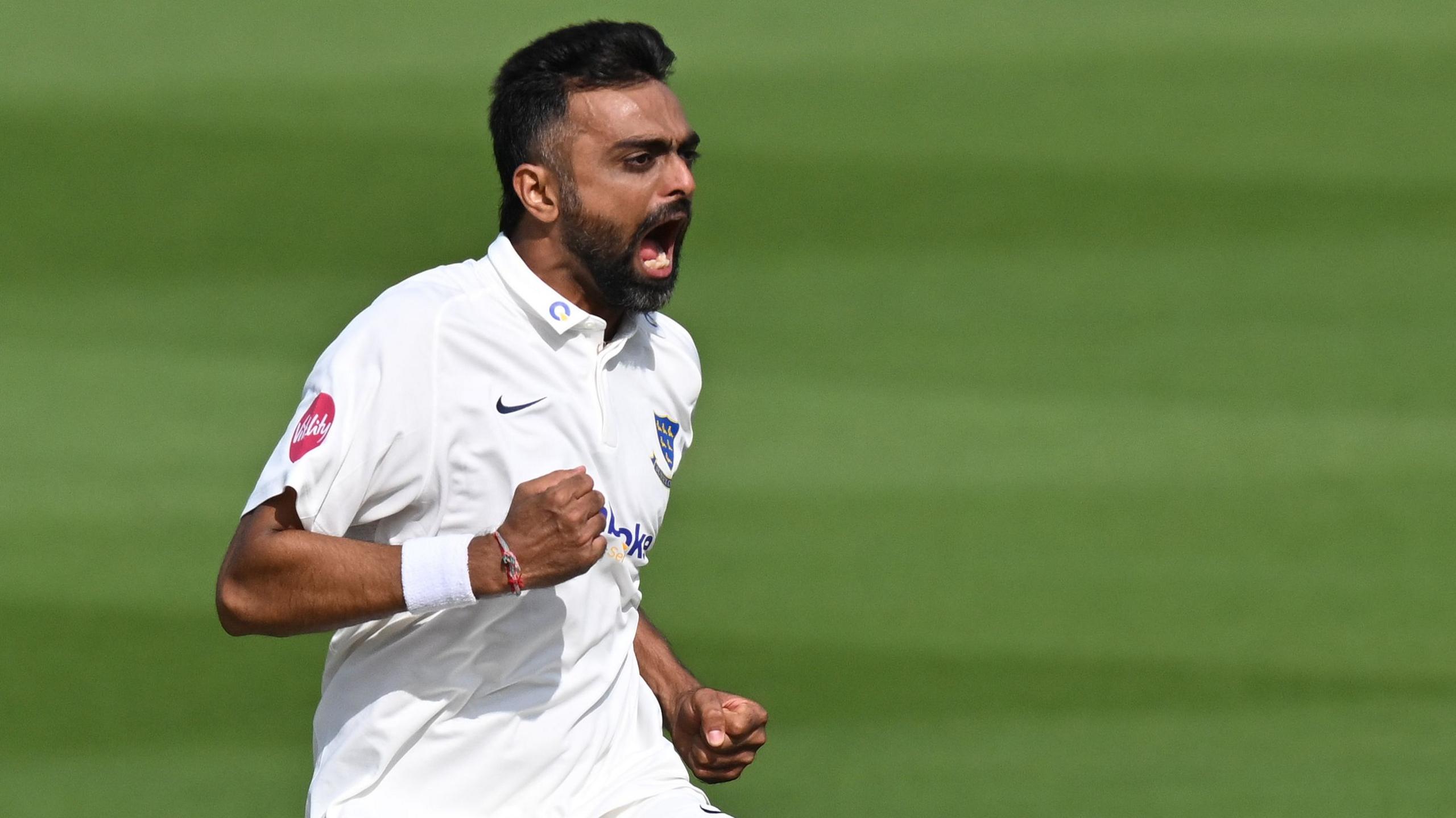 Sussex bowler Jaydev Unadkat celebrates taking a wicket