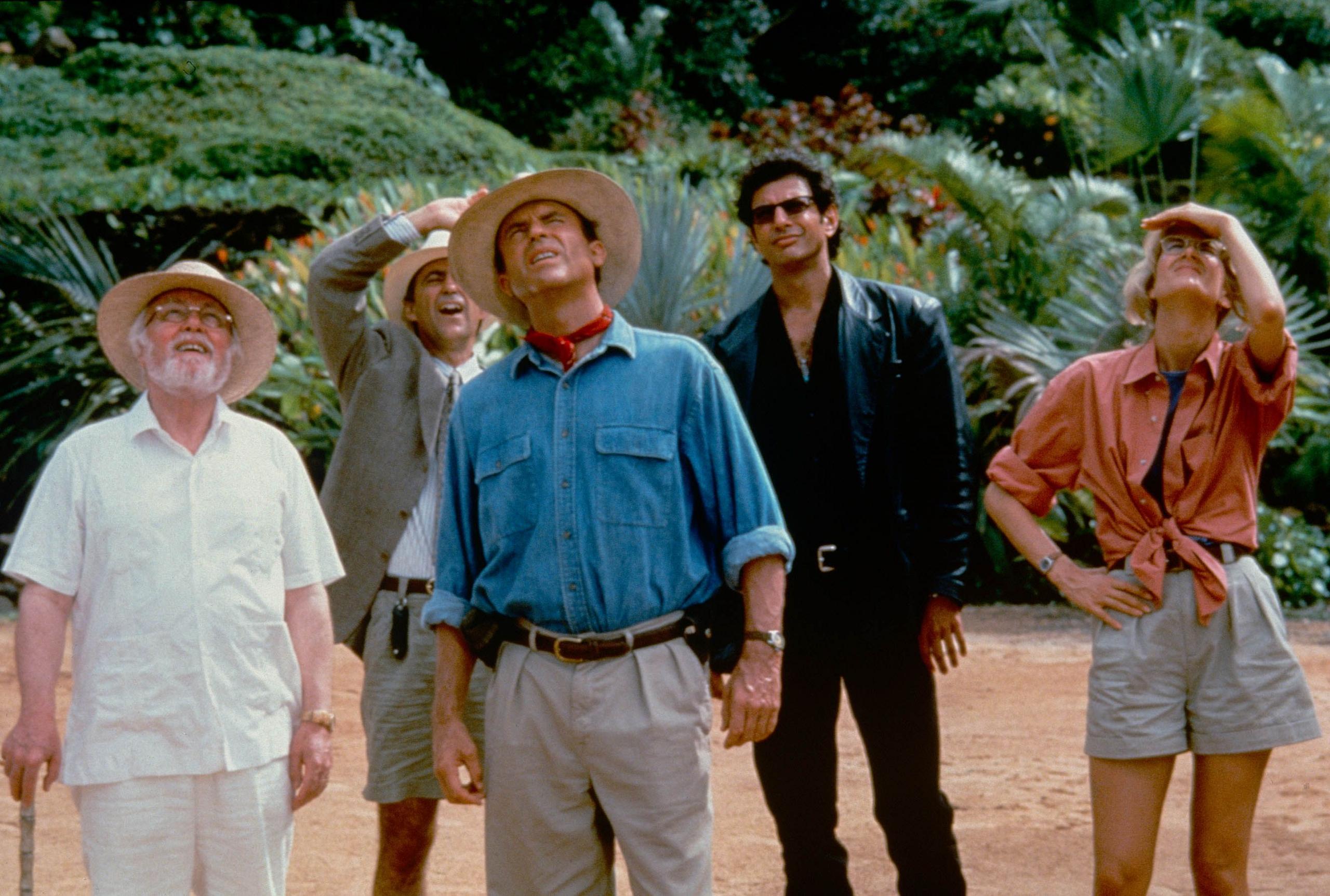 View of, from left, actors Richard Attenborough (in costume as John Hammond), Martin Ferrero (as Donald Gennaro), Sam Neill (as Alan Grant), Jeff Goldblum (as Ian Malcolm), and Laura Dern (as Ellie Sattler) in the film 'Jurassic Park' (directed by Steven Spielberg), 1993. (Photo by 