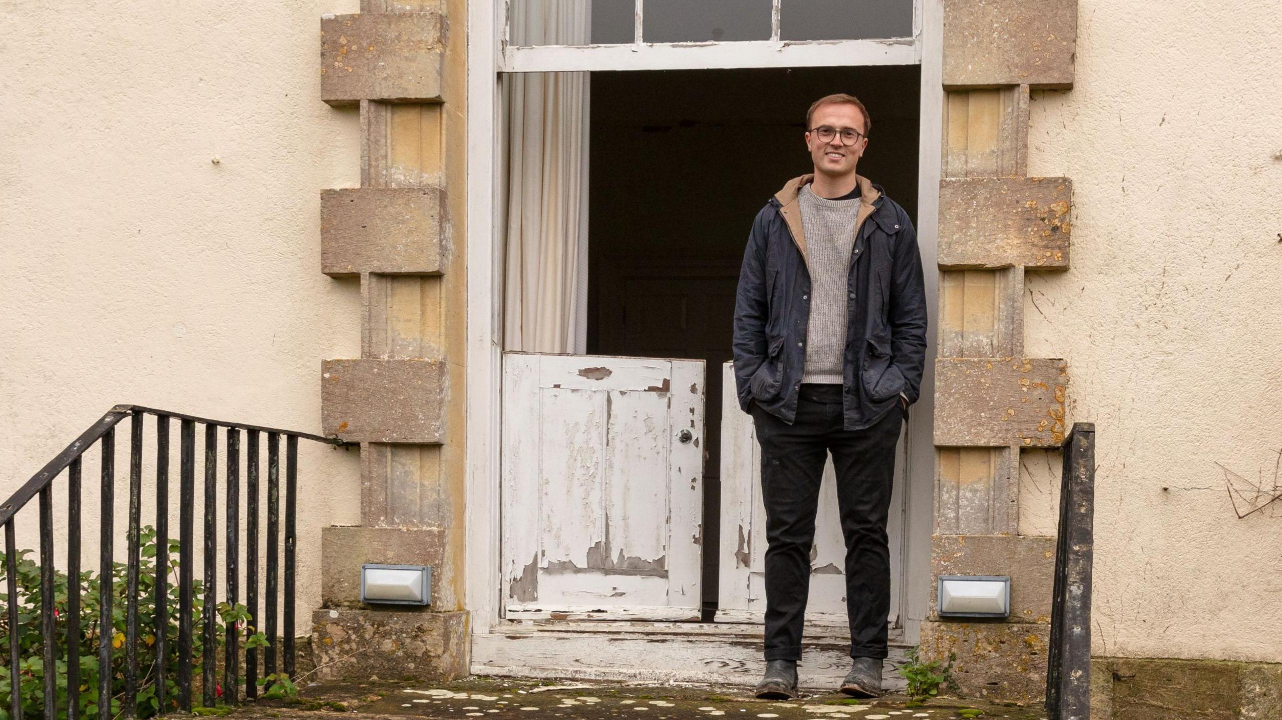 Arthur Dallimer standing outside Burderop House