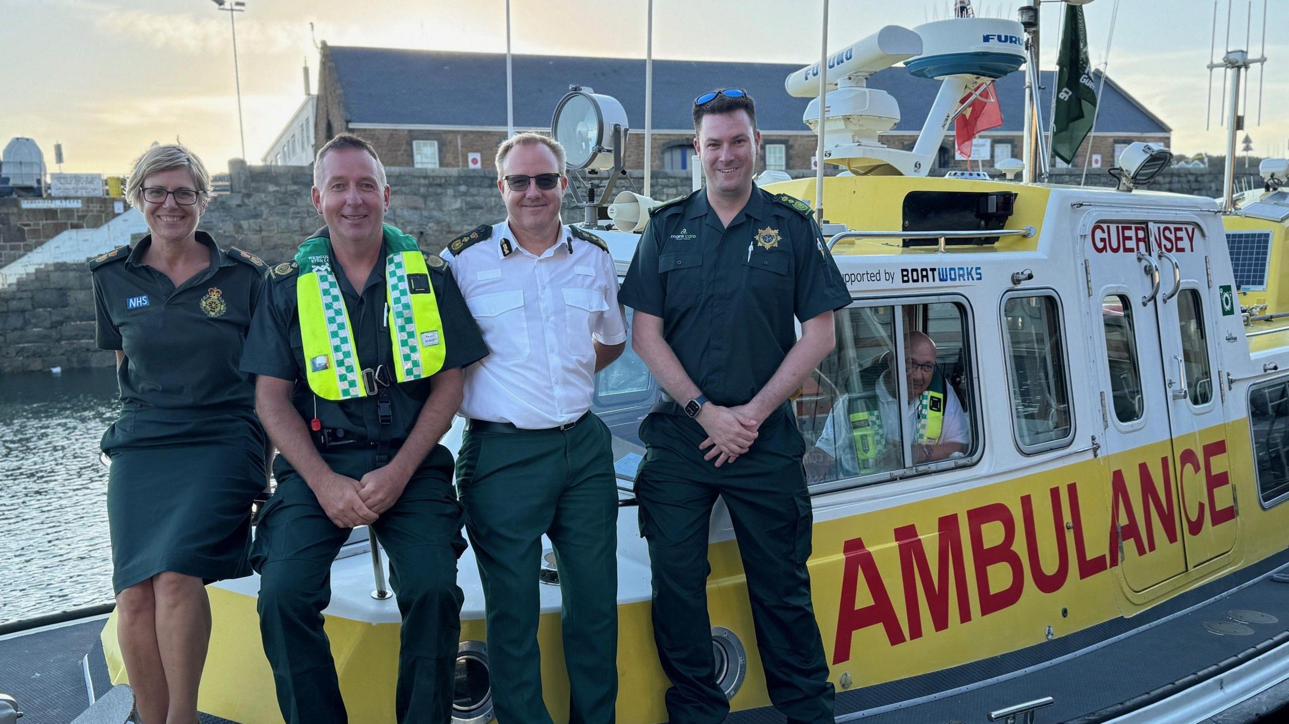 Ambulance workers pose for a picture aboard the Guernsey ambulance boat.