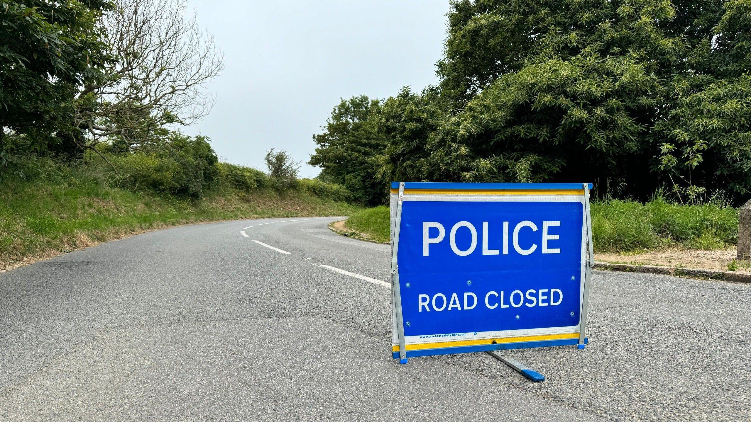 A police sign reading road closed on the La Route du Nord