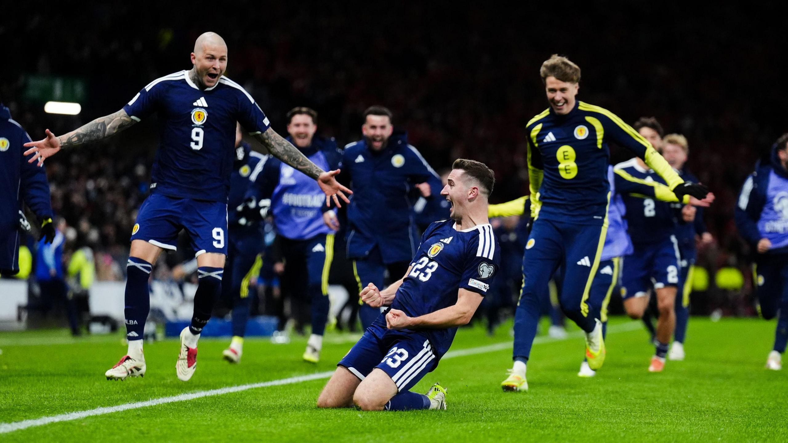Kenny McLean celebrates sending Scotland to the 2026 World Cup with a win over Denmark.