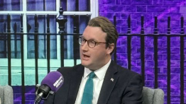 David talking into microphone during election debate