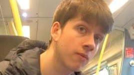 A picture of Thomas Dures, 21, who is wearing a black coat and has short light brown hair