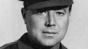 A head and shoulders shot of a clean-shaven man wearing military uniform, taken from his personnel file