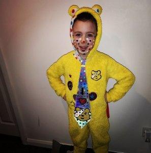 Image of boy in a Pudsey onesie