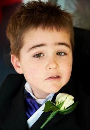 Ollie at his parents' wedding after his diagnosis with a brain tumour