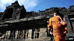 Buddhist monks walk into temple of Borobudur, Indonesia, during Vesak Day celebrations, May 2010