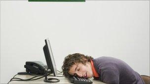 Man napping at desk