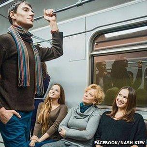 A man standing on the metro while women gaze at him