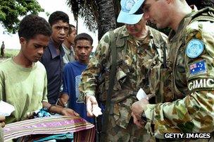 Australian troops buy souvenirs before leaving East Timor, 2005