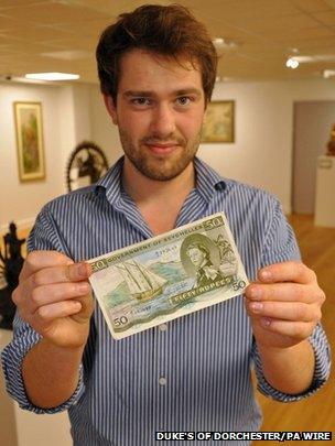 Timothy Medhurst holding the note