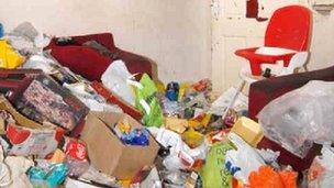 The rubbish-strewn living room in Amanda Hutton's house