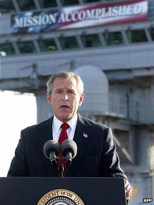 US President George Bush addresses the nation on Iraq beneath a banner reading "Mission Accomplished" aboard the nuclear aircraft carrier USS Abraham Lincoln on 30 April 2003