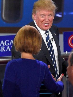 Republican presidential candidate, businessman Donald Trump, top, talks with Carly Fiorina following the CNN Republican presidential debate at the Ronald Reagan Presidential Library and Museum on Wednesday, Sept. 16, 2015, in Simi Valley, Calif.