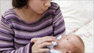 Young mother holding her baby