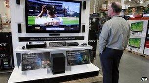 Man watching TV in California shop - file photo