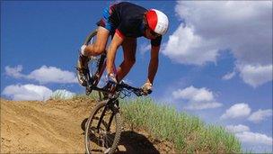 A man mountain biking