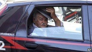 An unidentified man in a Carabinieri car after being arrested in southern Italy on July 13, 2010