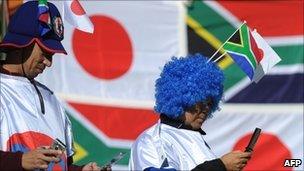 Japan football fans on phones