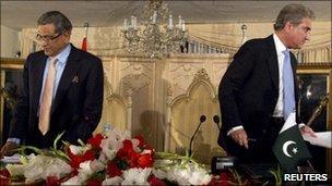 Pakistan’s Foreign Minister Shah Mehmood Qureshi (right) and his Indian counterpart SM Krishna turn away after their joint news conference in Islamabad on 15 July 2010