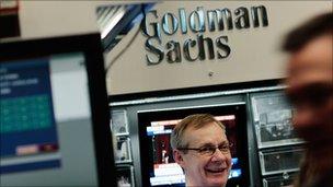 Financial professional stands in the Goldman Sachs booth at the New York Stock Exchange