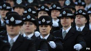 Newly qualified police officers at the Peel Centre in Hendon, north London take part in a passing out parade.