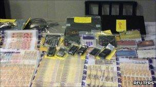 Cash and equipment seized in Hong Kong raids