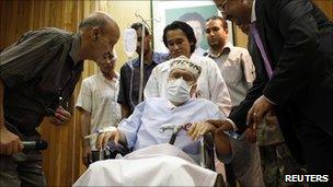 photo of Abdel Basset al-Megrahi sitting in a wheelchair in his room at a hospital in Tripoli