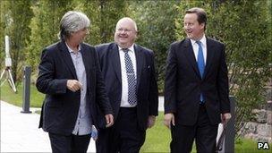 Phil Redmond, Eric Pickles communities minister and David Cameron before the 'big society' speech