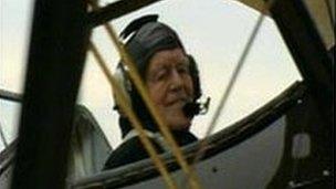 Claude in a biplane