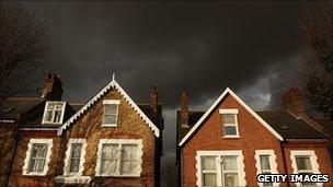 Houses under dark skies