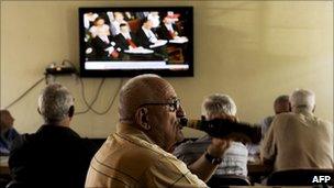 Kosovo Albanians watch the ruling in Pristina