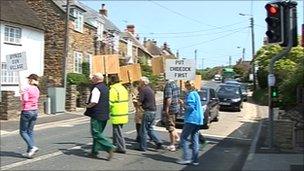 Protesters at a pelican crossing