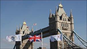 The Olympic, Union Jack and Paralympic flags fly in front of Tower Bridge in London