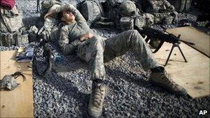 A US soldier rests between patrols in the Arghandab valley